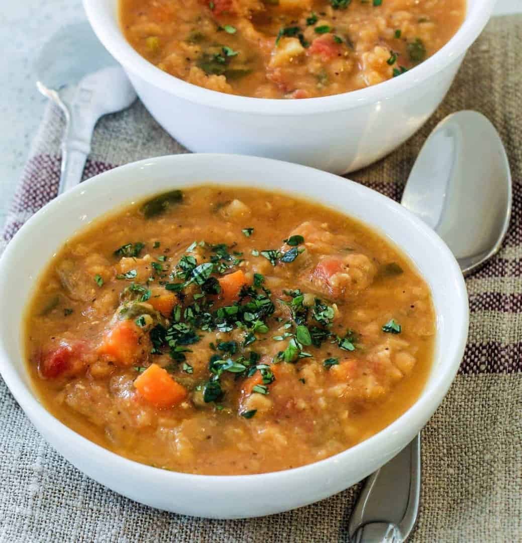 two bowls of creamy red lentil soup