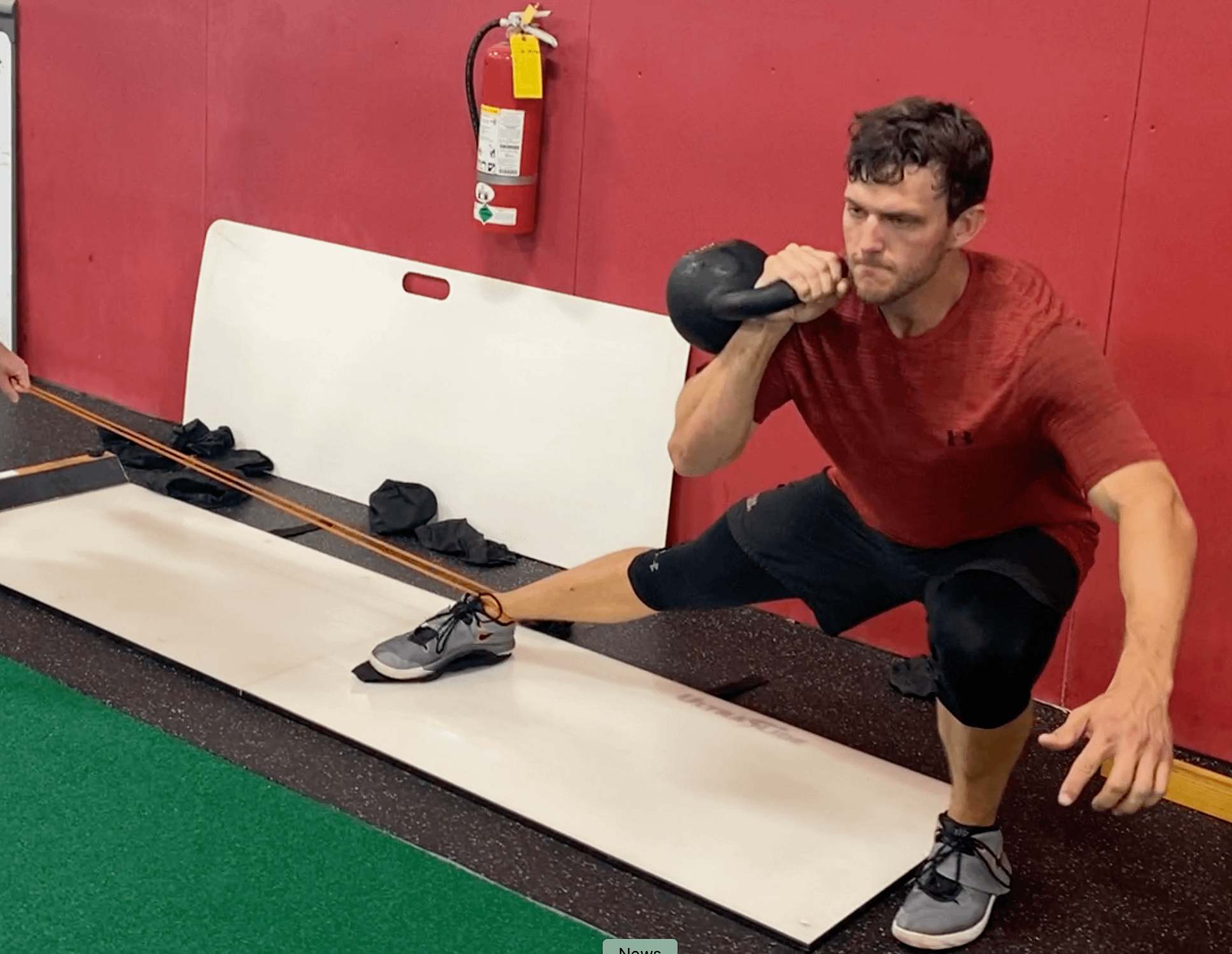 Slideboard Lateral Lunge with Eccentric Band Overload